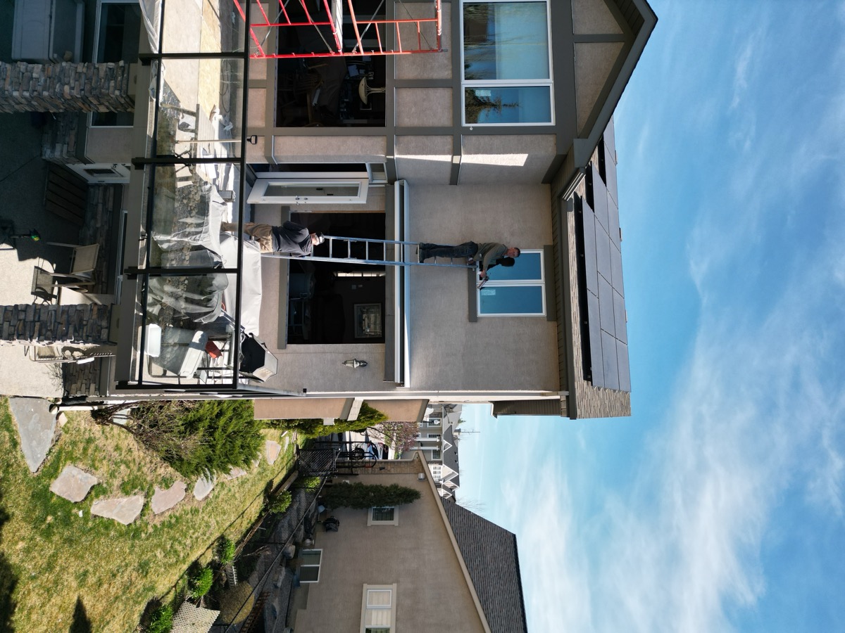 Sunbusters crew installing windows on a Calgary home